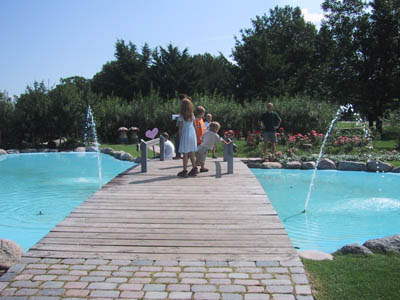 Children on Bridge over Water