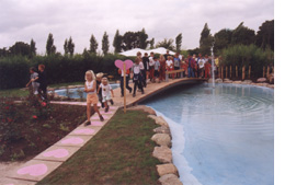 Children on Bridge over Water